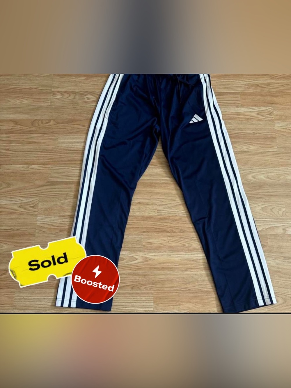 SOLD!! adidas new three stripes multi sport pants.